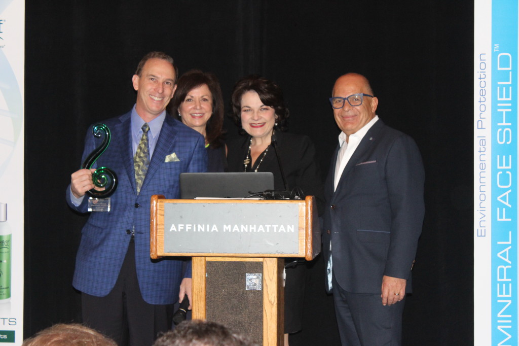 (Dr. Samuel and Joni Shatkin accepting the Trendsetter of the Year award from Lydia and David Sarfati)